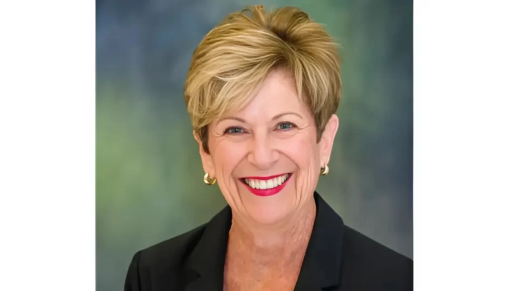 Smiling portrait of Marcia Butler in a business suit.